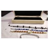 Black beaded necklace, blue beaded necklace more