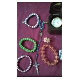 Clock in wooden box , rosary and jewelry