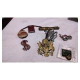 Three money clips, four pins and a patch