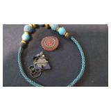 turqouise necklace, and metal necklace