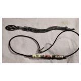 Four bracelets and a necklace.