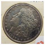 1897 Morgan silver dollar.