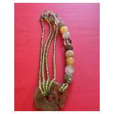 Multi-strand Necklace with a Carved Jade Pendant