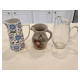 (2) Stoneware Pitchers & a Glass Pitcher
