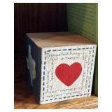 Wooden block or cube featuring themes related to