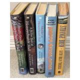 A Set of cozy mystery novels, including several