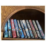 A collection of books authored by Clive Cussler &
