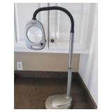 Magnifier on an adjustable stand