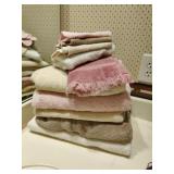 Set of pink and cream colored bath towels