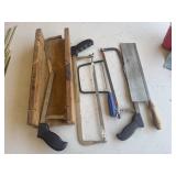 Metal framed hacksaws, a coping saw, and a wooden