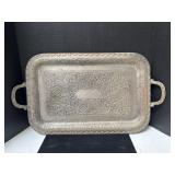 A ornate, rectangular silver