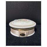 A vintage floral porcelain trinket box,(Needs