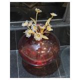 Spherical Glass Vase Holding a Decorative