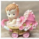 Baby Girl in A Pink Bassinet