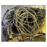 assorted extension cords and electrical cables