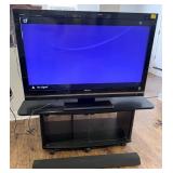 46" Sony tv, bar speaker, rolling stand