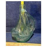 Glass bottle shaped like sailboat