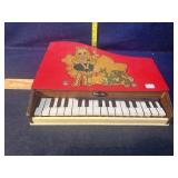 Toy baby grand piano missing all legs