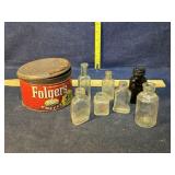 Old bottles in a very old Folgers tin