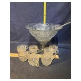 punch bowl with ladle and cups