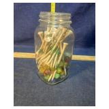 Golf tees and marbles