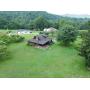 Beautiful Log Cabin on Nearly 2 Acres in Lumberport