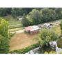 Business Opportunity: Multi-Use Building w/ Elk River Frontage in Clay County