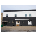 Versatile Commercial Building with Income Generating Apartments in Sutton 