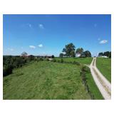 106 Acres with 3 Bedroom Brick Home and Barns in Parkersburg