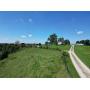 106 Acres with 3 Bedroom Brick Home and Barns in Parkersburg