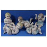 5 Playing Baby Ceramic Figurines-some chipped