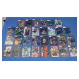 Assorted Football Cards in Top Loaders