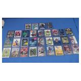 Assorted Football Cards in Top Loaders