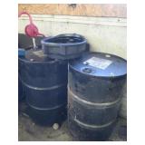 2 55 Gal. Oil Drums(one appears empty,one appears