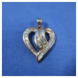 10K Diamond Heart Pendant approx 1/2CT TW dia.