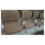 4 Swivel, wheeled, cushioned arm chairs