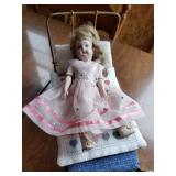 bisque jointed doll with wire bed