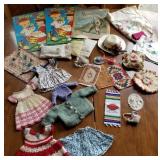 Box of doll clothes, books, linens