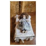 Signed doll with wire bed