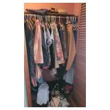 Contents of closet in bedroom at top of stairs