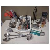 Lot of kitchenware, spatulas, garlic press, can