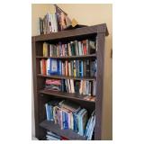 Books on brown bookshelf - Contents