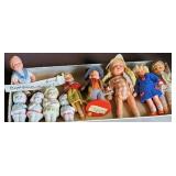 Box of miniature dolls including Swiss