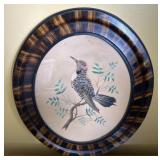 Antique feathered bird art in oval frame approx