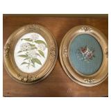 2 gilded oval frames w/ floral themed art