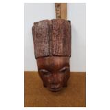 Carved wooden face