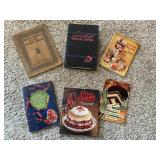 6 Vintage cookbooks.  Pages show the year they