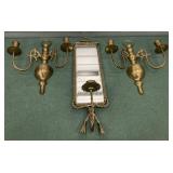 Vintage brass wall sconce with a mirror and two
