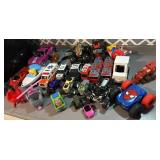 Misct oys, monster trucks, Cocomelon tractor,