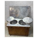 Antique fireless cooker in casters